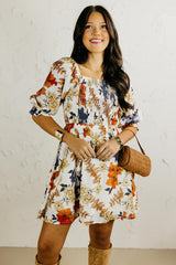 Woman wearing a floral dress with a white background