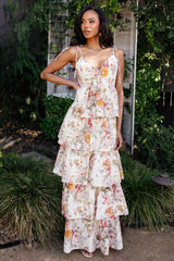 Back view showing smocked back and adjustable straps on the Angelica Tiered Maxi Dress in buttercream multi floral, lined through the final tier.