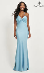 A woman models the Faviana Twist-Knot Long Satin Prom Dress 11066 in light blue, featuring a twisted front detail, standing against a white background with the Faviana logo in the top right corner.