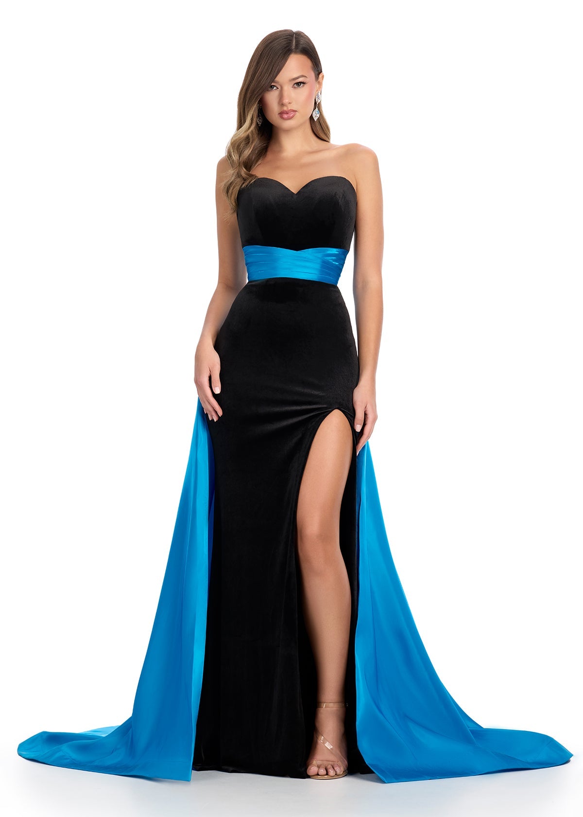 Elevate your formal wear with the Ashley Lauren 11857 Long Fitted Velvet Pageant Dress. Crafted from luxurious velvet, this gown is tailored to accentuate your figure. The elegant satin overskirt adds a touch of sophistication, making it perfect for any formal occasion. Make a statement with this stunning evening gown. We are obsessed with this classic strapless velvet dress with a left leg slit. The dress is finished with a gorgeous satin overskirt sinching the waist and oozing elegance.
Strapless Ne