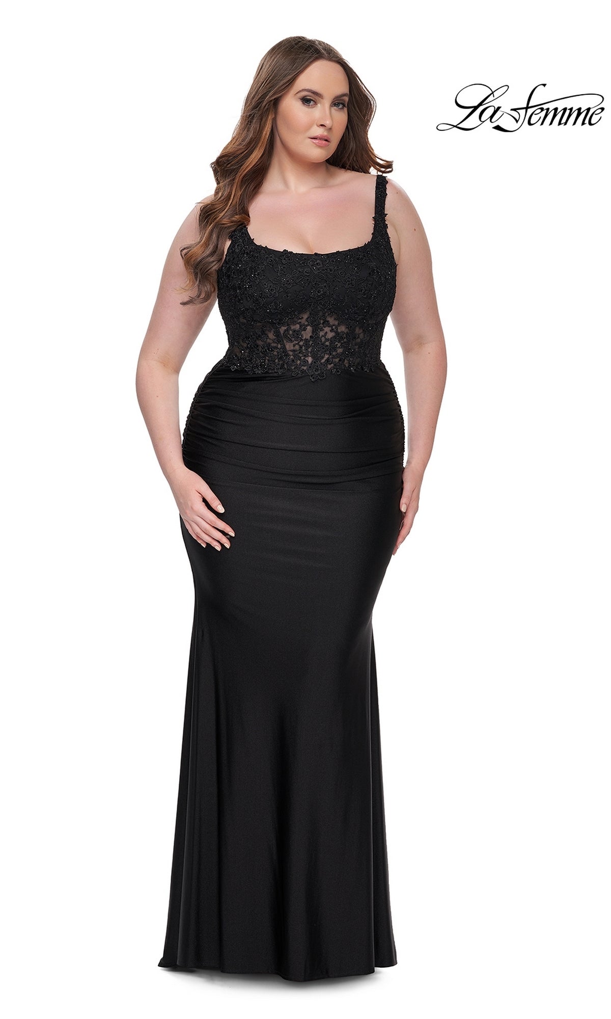 A woman models the La Femme Long Prom Dress 31273, featuring a black lace bodice and fitted skirt, against a plain white background. The "La Femme" logo appears in the top right corner.
