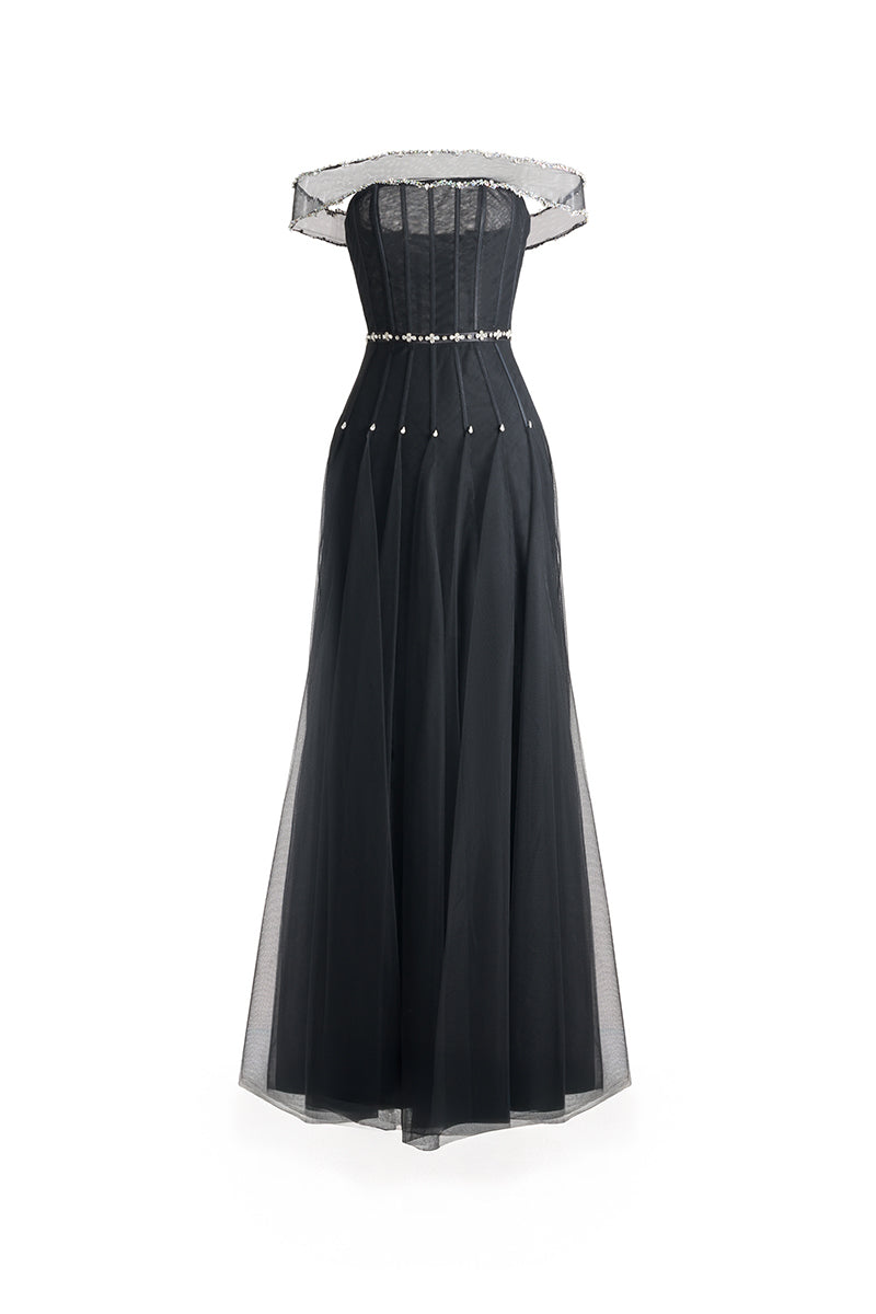 Black off-shoulder organza maxi dress from Happy Clothing, flowing elegant design with ruffled neckline and full-length skirt.