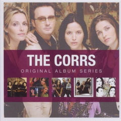 "The Corrs album cover featuring a band photo and five smaller album covers."