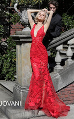 Jovani 60283 Plunging Neckline Prom Dress 60283 Evening gown Sheer mesh, sequin flower appliques, form fitting silhouette, floor length, sleeveless bodice, plunging V neck, V back, sheer mesh inserts on the sides. Available size 10 - Red