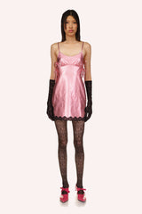 Bubblegum, sleeveless, 2-straps, wavy black lace at bottom, pink grommets to adjust