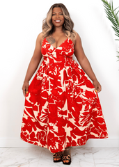Front view of red floral maxi dress on curvy model – bold summer vacation dress from Opulent Gurlz