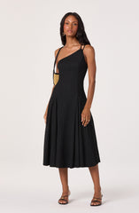 Woman in a black sleeveless, midi-length dress with thin shoulder straps.