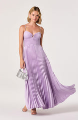 Women wearing a lavender pleated maxi dress with spaghetti straps and a cut-out detail at the bust.