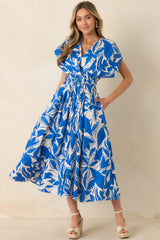 Blue and ivory maxi dress with deep V-neckline and concealed button-front placket.