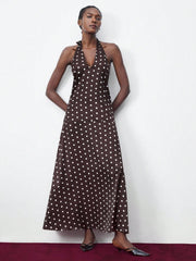 Turn heads this summer with our Chic Women's Polka Dot Halter Backless Dress. Its playful halter neck and breezy backless design keep you cool, while the elegant long silhouette makes it perfect for parties and graduations. Dance the night away in style and comfort with this timeless, fun floral favorite.