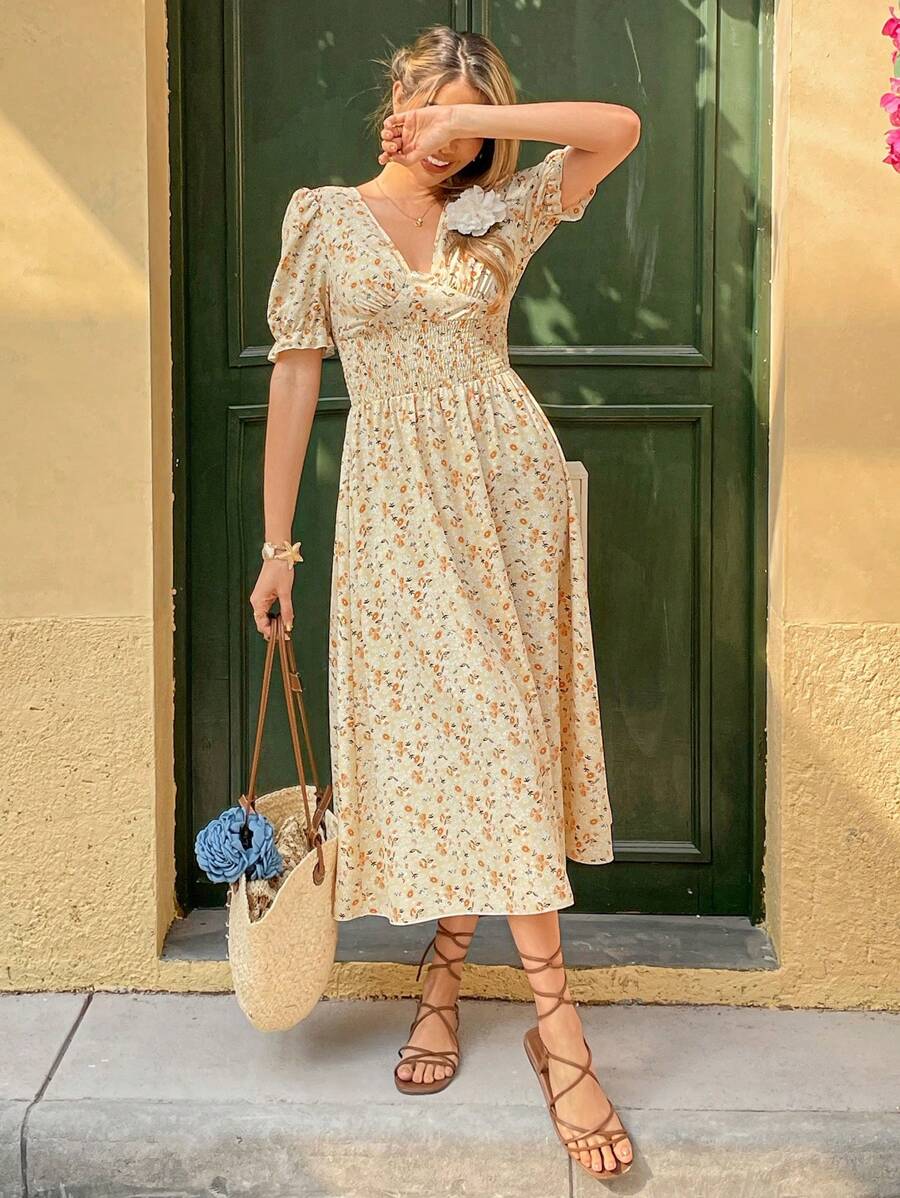 Channel effortless style in this chic yellow ditsy floral midi dress with puff sleeves. Perfect for spring and summer, this dress will keep you looking fresh and stylish with its playful design. Add some flair to your wardrobe with this must-have piece.