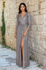 A stunning charcoal long sleeve formal dress adorned with intricate hand-beaded sequins, showcasing elegance and sophistication.