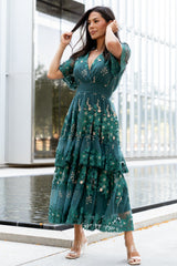 Front view of Lotte emerald midi dress showing deep teal tulle, crossover V-neck and layered gold and emerald floral embroidery across the bodice.