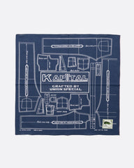 A navy cotton bandana with a pattern for a Barbie sized outfit in white and 'KAPITAL CRAFTED BY UNION SPECIAL' at the center. Shown from the front.