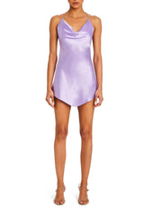 Lavender silk mini dress with halter straps and a draped neckline on a model