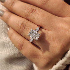 Cathedral setting ring with radiant cut diamond.
