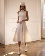 Elegant white midi dress with a high neckline