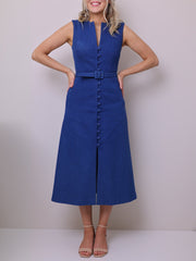 Sewing pattern for a sleeveless midi Dress in blue denim fabric, featuring a V-neckline, shank buttons, belt, and pockets.