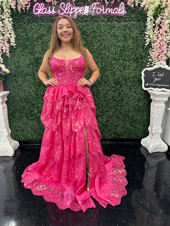 The Jovani 38144 prom dress is a true showstopper and a perfect choice for those looking to make a statement at a formal event. This gown belongs to the formal collection and is designed to capture attention and create a memorable look. The dress is crafted from delicate and ethereal tulle material, which gives it a light and airy quality while maintaining a sense of sophistication.