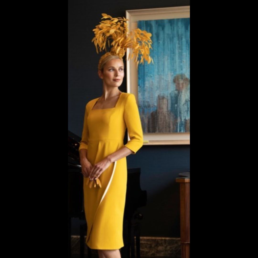This fitted dress in high quality crepe has a flattering drape on the skirt across the tummy. The dress has three quarter sleeves and is fully lined in satin with a back zip.