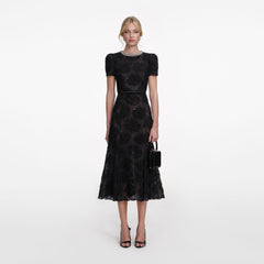 Front view of a woman wearing the Black Tulle Lace Midi Dress
