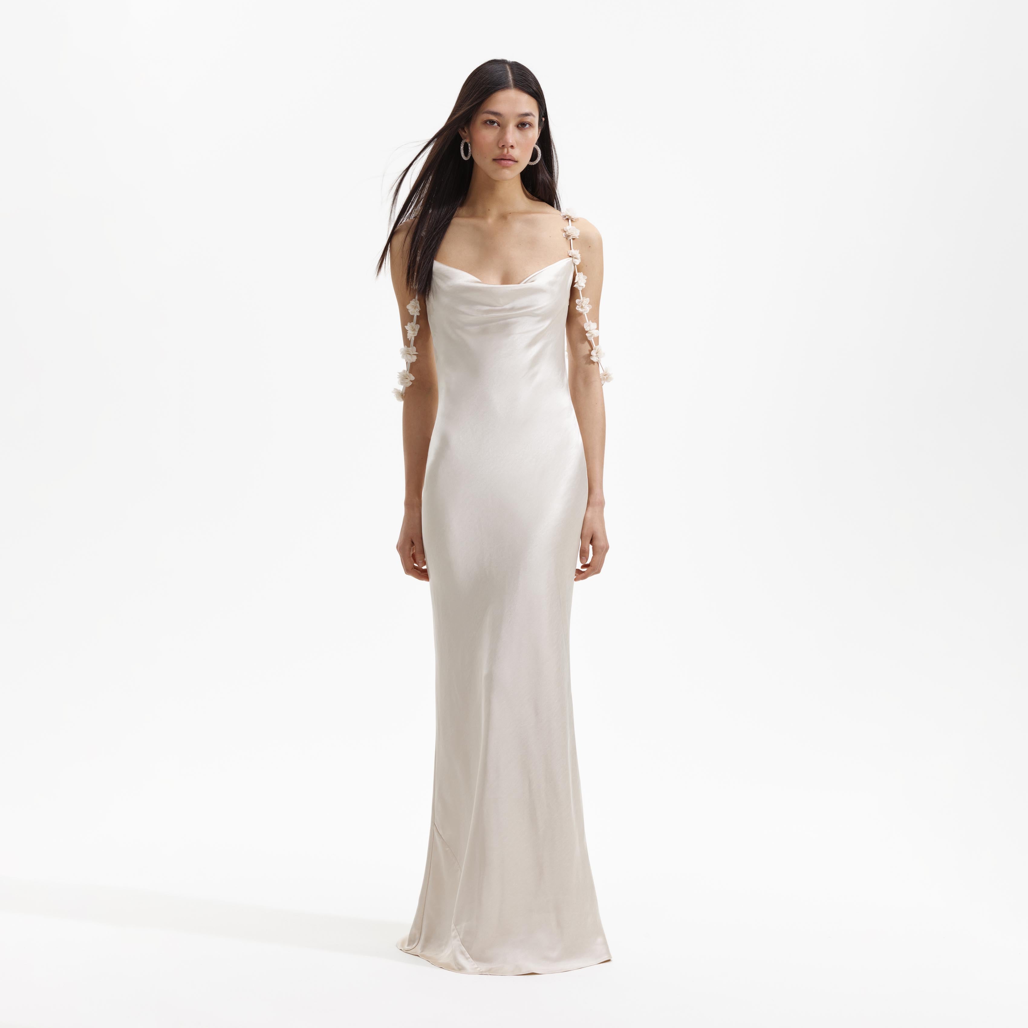 Front view of a woman wearing the Champagne Satin Flower Maxi Dress