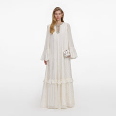 Front view of a woman wearing the Cream And Gold Chiffon Maxi Dress