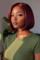 Woman with a stylish haircut and makeup, wearing a green top, with 'Obroi' branding.