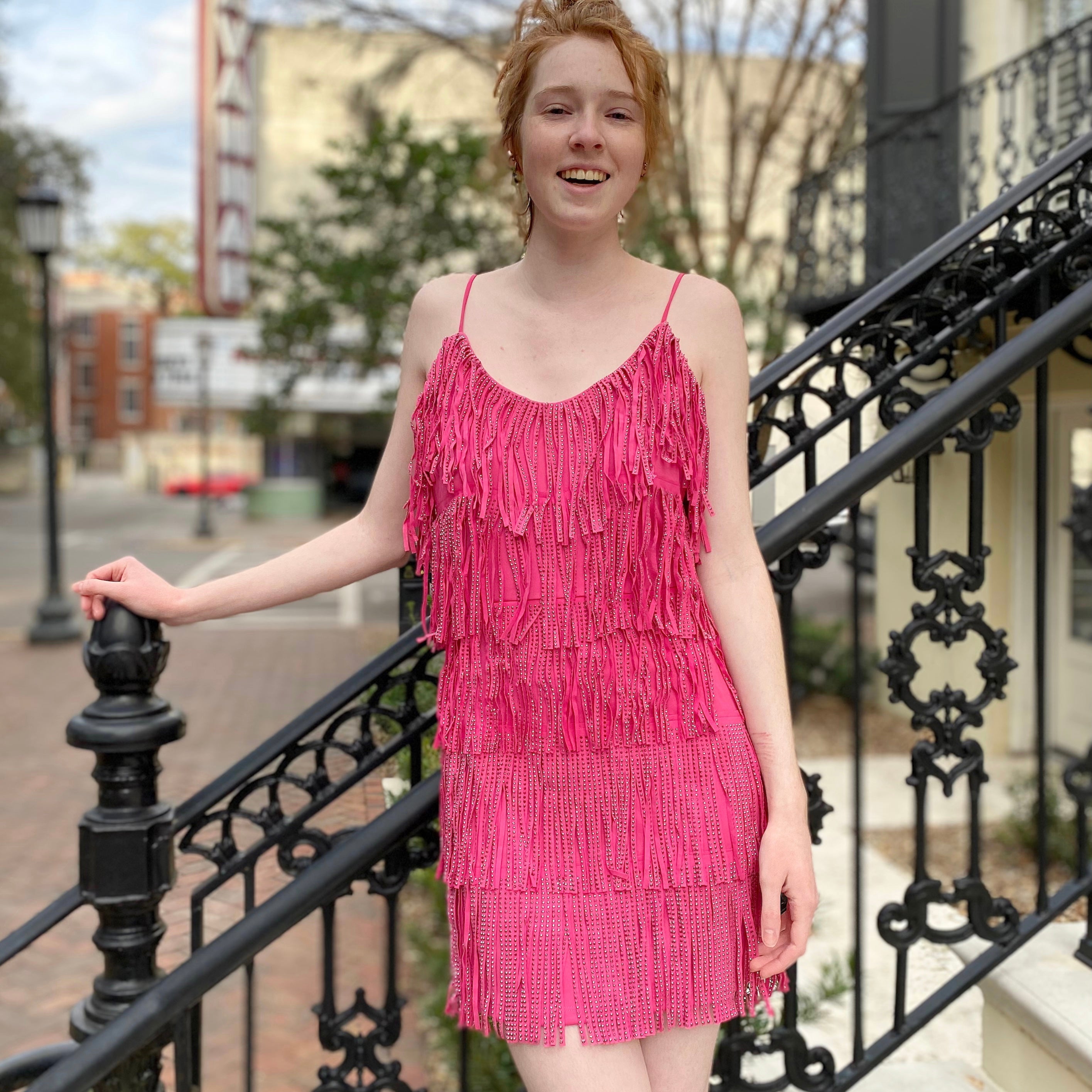 Dance the night away in this hot pink fringe, faux leather, sequin fabric minidress. The fabric contents are 95% polyester and 5% spandex.