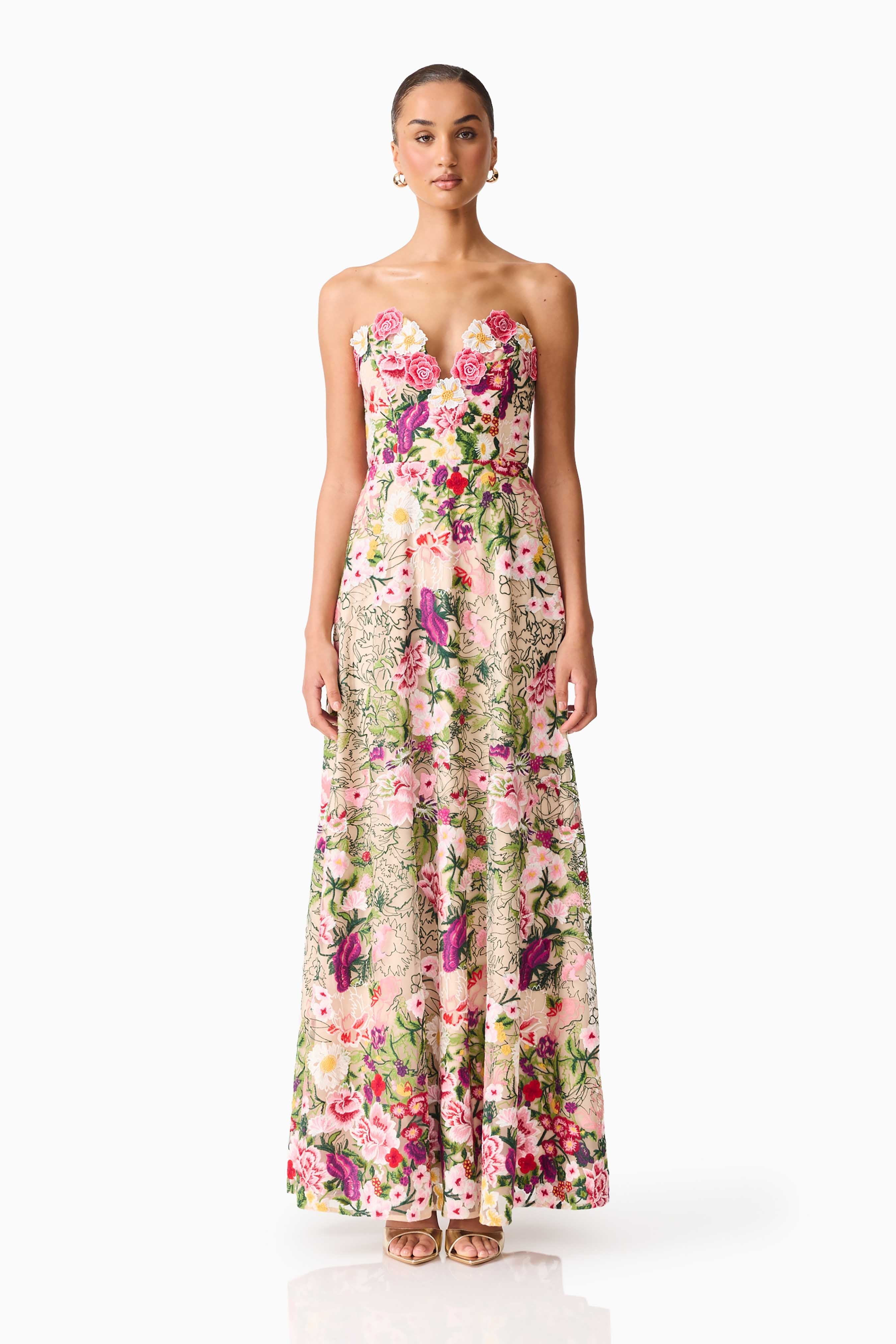 Brunette model wearing the Flora Strapless Gown in Pink & Green Floral front shot