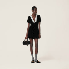 Introducing the luxurious MIU MIU V-neck organza-trimmed velvet minidress. Featuring new crystal button accents, silk lace splicing and elegant bubble sleeves, this dress exudes sophistication and style. Elevate your wardrobe with this must-have dress.
