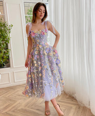 Purple midi dress with spaghetti straps and embroidered flowers