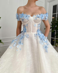 A line white bridal dress with off the shoulder sleeves and embroidered blue flowers