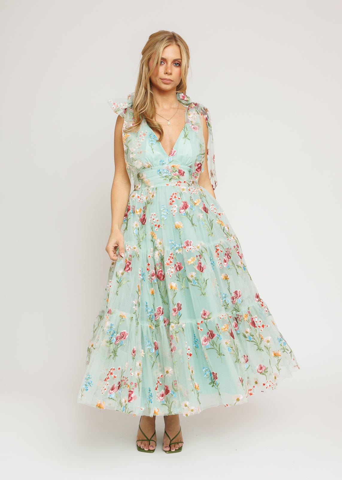 chic size inclusive model wearing JessaKae Margaret Floral Midi Dress Green Dresses