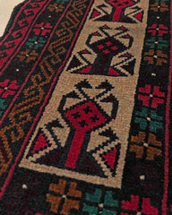 Detail of a Baluch Turkmen Prayer Rug - Handmade Wool Carpet in a 3x5 size, featuring traditional tribal geometric patterns with rich red, black, beige, green, and teal colors. Ideal for living room, bedroom, kitchen, entryway, or nursery decor. Available at a handmade rug shop in the San Francisco Bay Area.