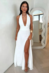 Front view of the Calanta white formal gown by Kouvr, highlighting the halter neck and flowing A-line skirt