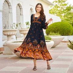 Woman twirling in a black A-line midi dress with full sleeves — perfect for festive evenings and vacations.
