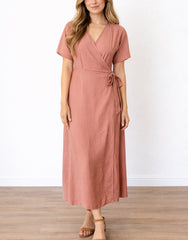 Woman wearing a pink Kimono Sleeve Wrap Maxi Dress on a white background.