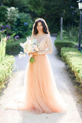 Tulle wedding gown with embroidered corset top photo 1