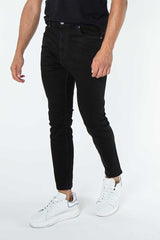 alt="Francisco Tolli black carrot denim jeans front view"