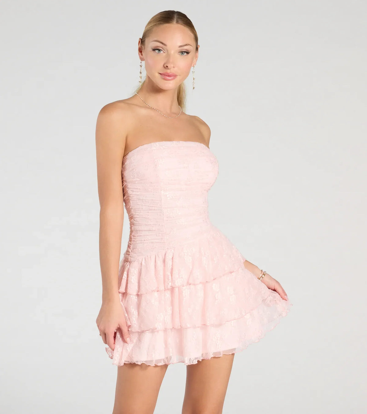 Bring a fun and feminine vibe with the Lovely Nights Strapless Lace Ruffle Skater Dress, a scroll-stopping style from Windsor's pink homecoming dress collection that brings playful charm to every HOCO moment.