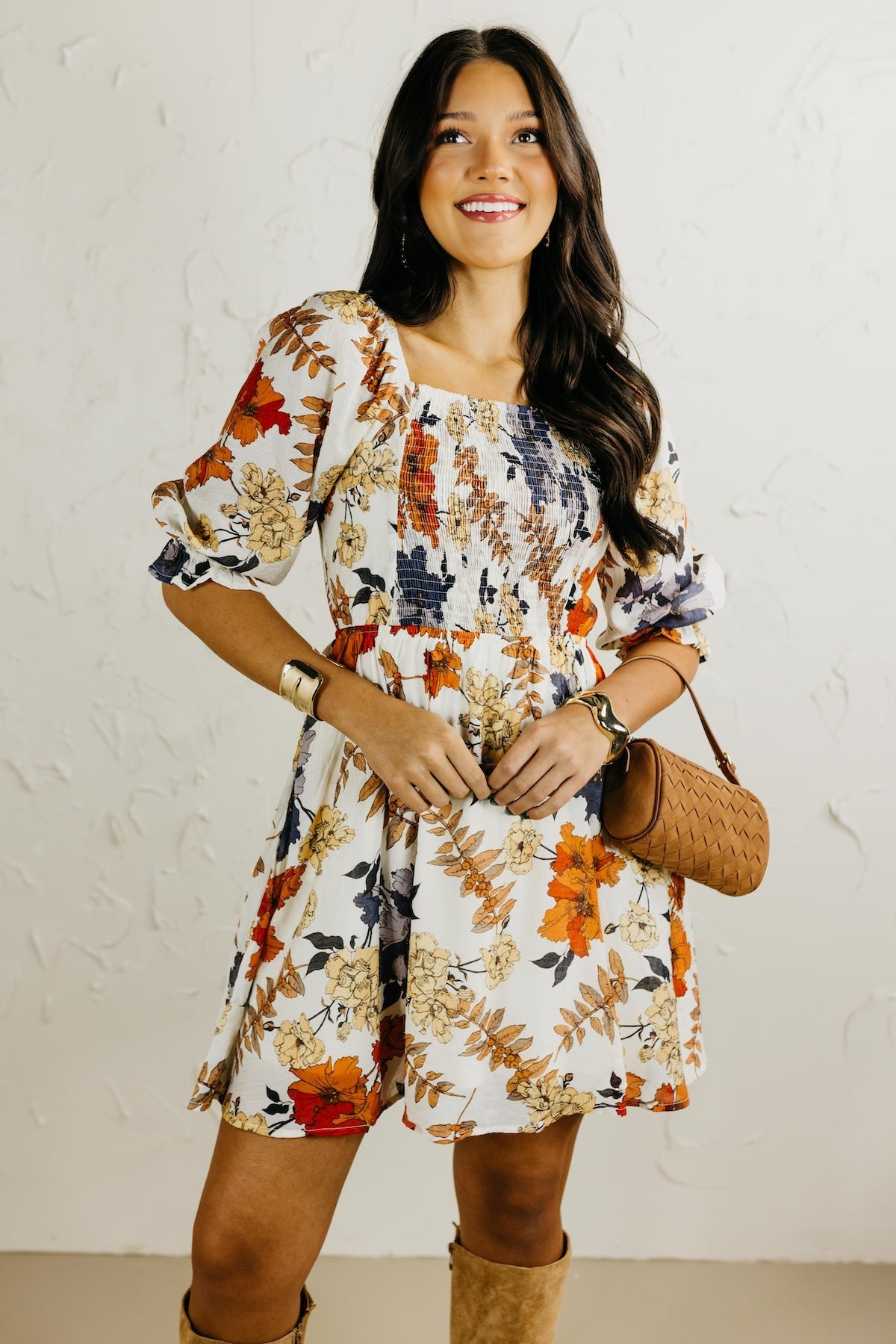 Woman wearing a floral dress with a white background
