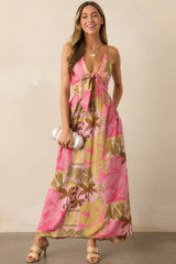 A pink dress with a deep v-neckline, self-tie front, and flattering cutout detail just below the bust.