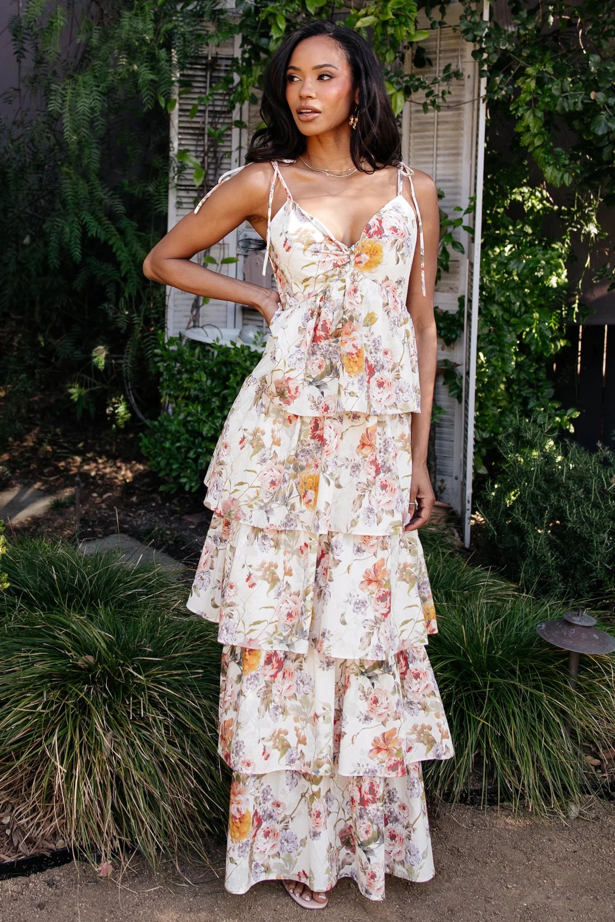 Back view showing smocked back and adjustable straps on the Angelica Tiered Maxi Dress in buttercream multi floral, lined through the final tier.