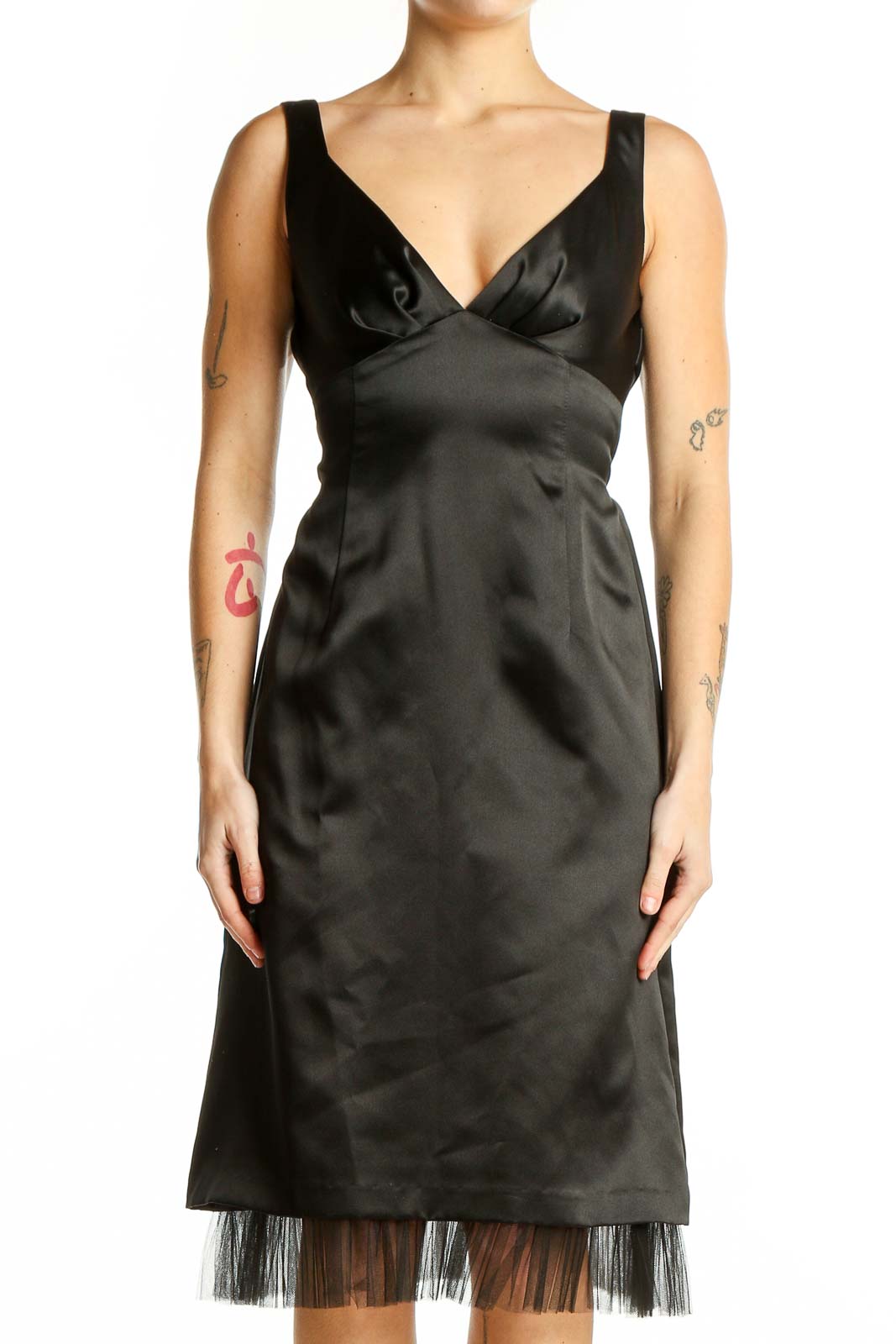Front view of black satin cocktail dress with V-neckline and tulle hem