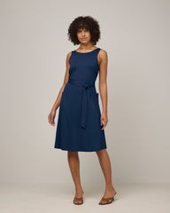 Model wearing Summer Reversible Dress in Marine Blue, a deep royal blue color. Summer Reversible Dress is a merino wool sleeveless, reversible, midi swing dress with pockets available in sizes XS-3X.