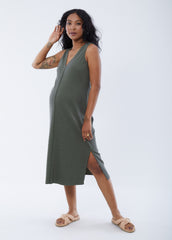 ||Olive::hover||Pregnant woman wearing green v-neck sleeveless dress on a plain background