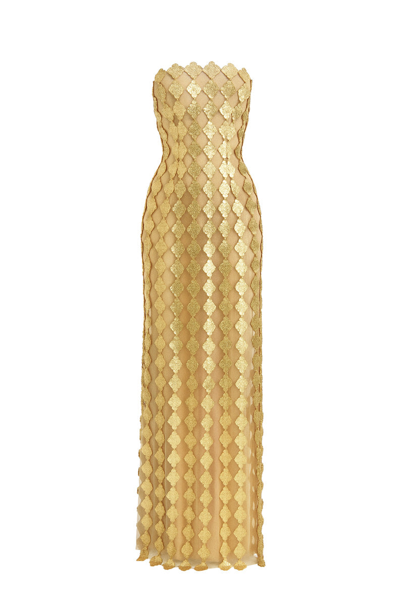 Gold long bodycon maxi dress by Phan Huy, featuring a fitted silhouette and elegant fabric, shown on a model.