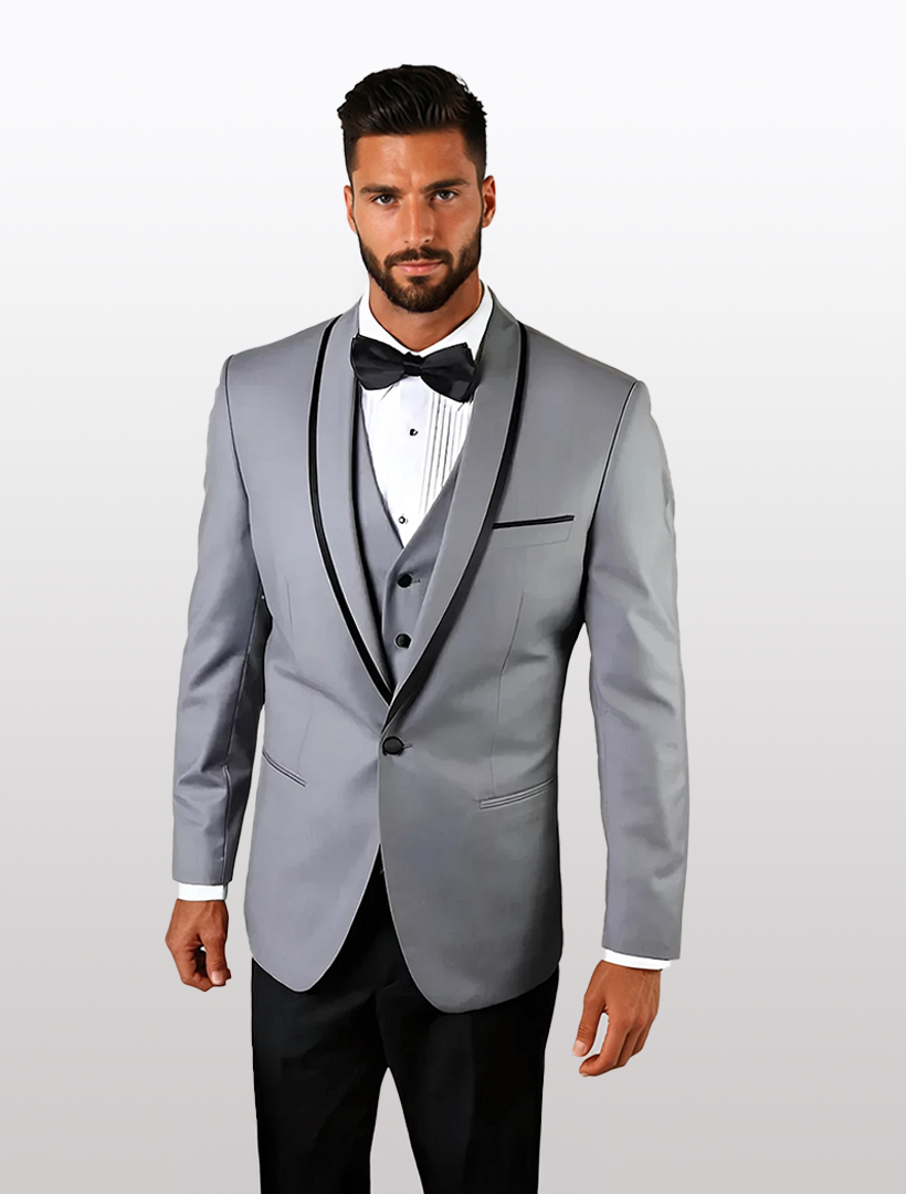 The man confidently wears a Statement Men's Grey with Black Lapel Vested 100% Wool Tuxedo, paired with a black bow tie and crisp white shirt against a plain backdrop.