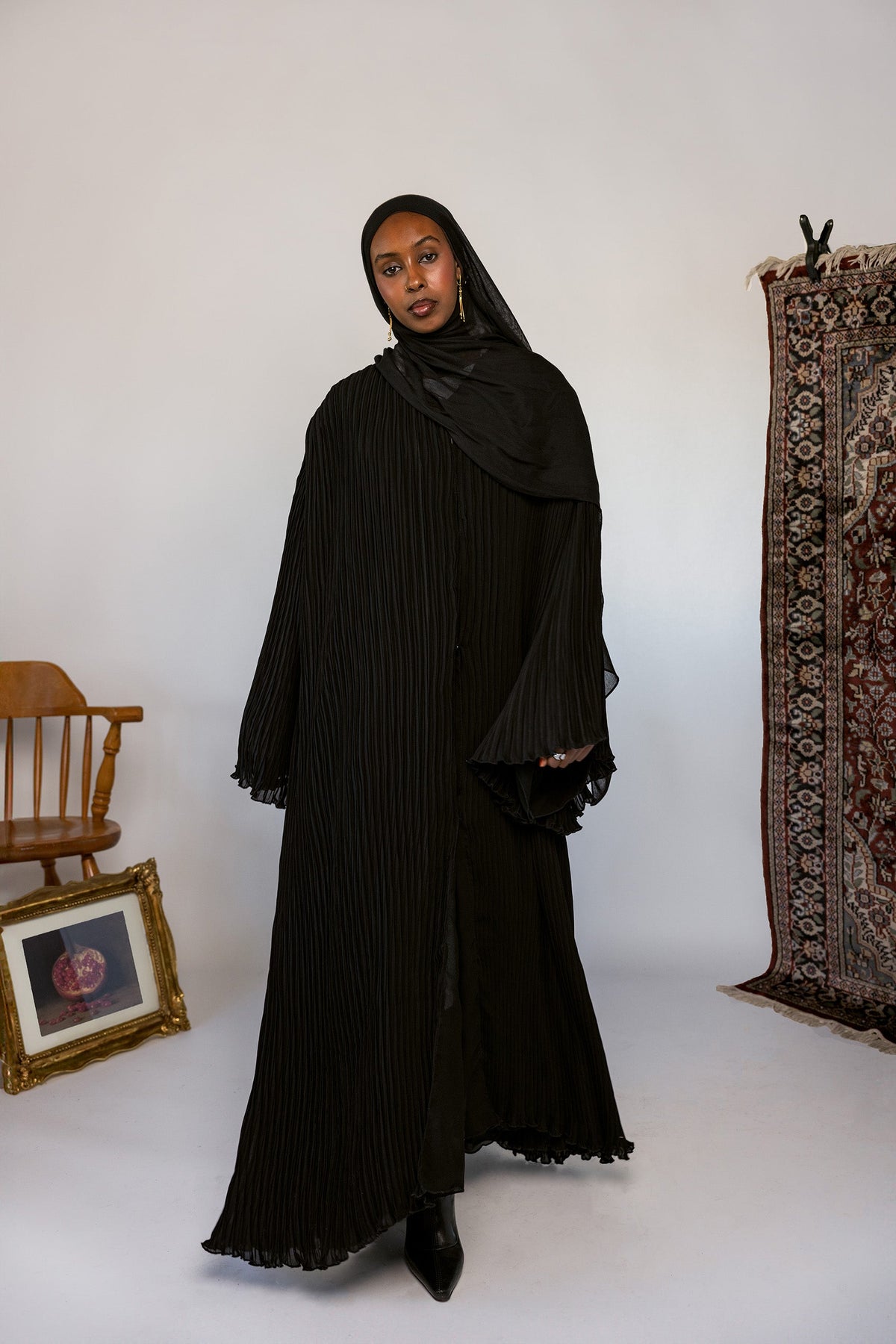 Full-length pleated abaya crafted from soft fabric with all-over flowing pleats.